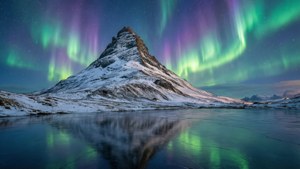 Aurora Over Snowy Peaks