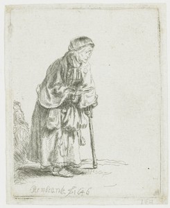 Beggar woman leaning on a stick