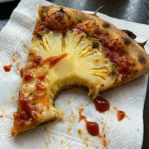 Bitten Pineapple Pizza Slice