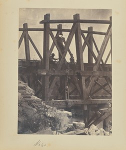 [Boring holes in a bridge truss for explosives]