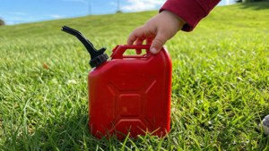 Child and Toy Gas Can