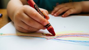 Child Drawing with Crayon
