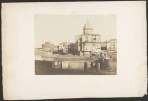 [Domed building across river]