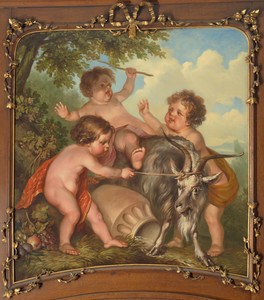 Drie kinderen spelend met een bok