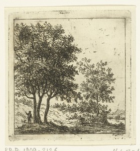 Een man met hond bij een groep bomen