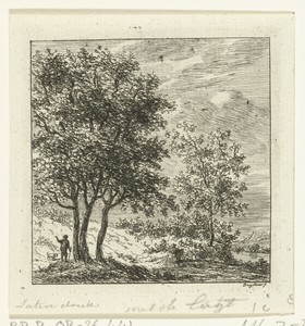 Een man met hond bij een groep bomen