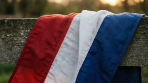 Flag on Wooden Fence