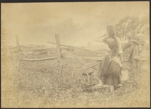 [Girl with Pail at Fence]