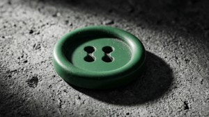 Green Button on Concrete