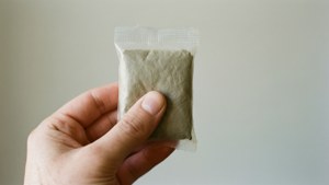 Hand Holding Yeast Packet