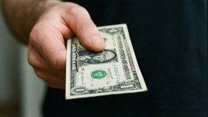 Hand Offering Dollar