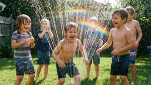 Kids Playing in Sprinkler