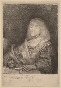 Man at a Desk Wearing a Cross and Chain
