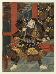 Man at temple gate with a bar in his mouth