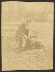 [Man Seated on Bench with Dog]