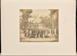 [Men gathered at an ablution fountain]