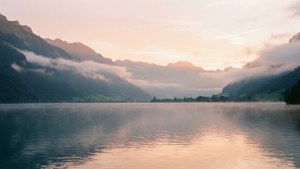 Misty Sunrise Over Lake Thun
