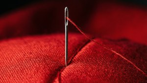 Needle in Red Fabric