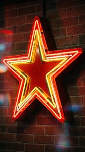 Neon Sign on Brick Wall