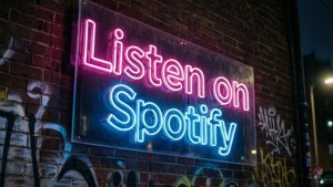 Neon Spotify Sign on Brick Wall
