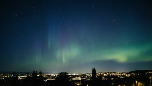Northern Lights Over City