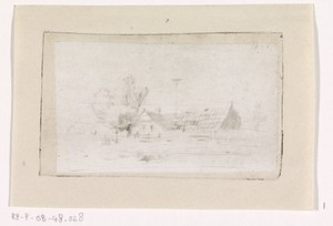 Ooievaarsnest tussen huizen aan de waterkant