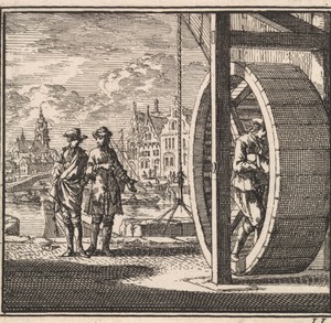 Op een kade worden goederen gelost met behulp van een tredmolen