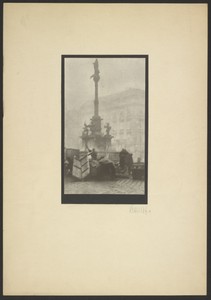 [People gathered around monument]