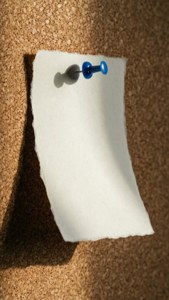 Pinned Index Card on Corkboard