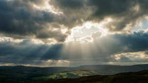 Rays of Light Over Hills