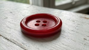 Red Button on Wood