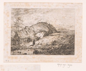 Rietgedekte boerderij in een landschap