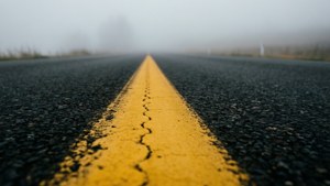 Road Dashes into Fog