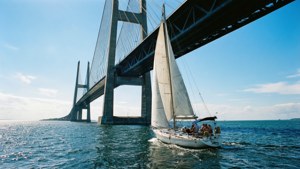 Sailboat Under Bridge