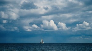 Sailboat Under Clouds