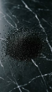 Scattered Black Sugar on Marble