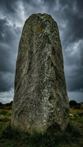 Solitary Menhir Under Storm Clouds