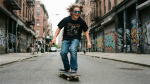 Son Skating Through City