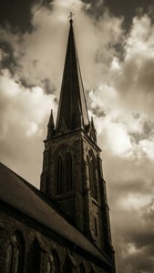 Spire Through Clouds