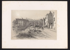 Stadsgezicht met huizen en karren langs een weg
