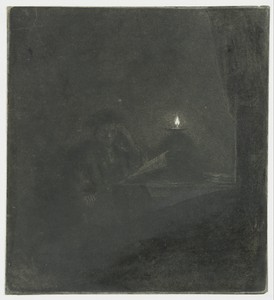 Student at a table by candlelight