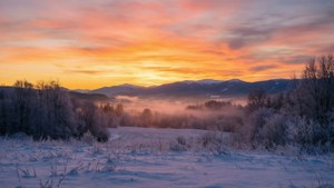 Sunrise Over Snowy Valley
