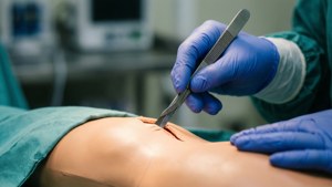 Surgeon Holding Scalpel