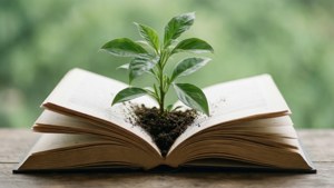 Textbook with Growing Plant