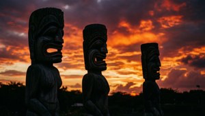 Tiki Statues Fiery Sunset