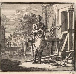 Timmerman wijst op de boor die hij in zijn hand heeft