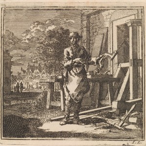 Timmerman wijst op de boor die hij in zijn hand heeft