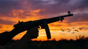 Tommy Gun Silhouette Sunset