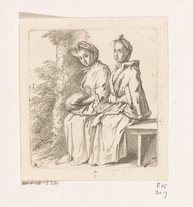 Twee dames zittend bij een boom