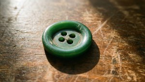 Vintage Green Button on Wood